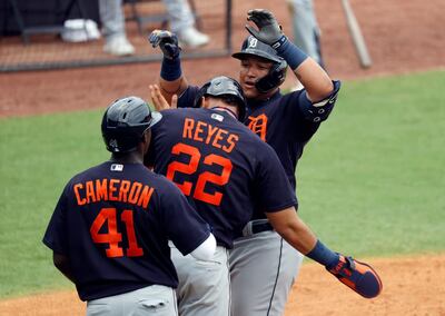 Mar 29, 2021; Tampa, Florida, USA; Detroit Tigers first baseman Miguel Cabrera (24) is congratulated by center fielder Daz Cameron (41) and center fielder Victor Reyes (22) after he hit a three-run home run during the fifth inning against the New York Yankees at George M. Steinbrenner Field. Mandatory Credit: Kim Klement-USA TODAY Sports