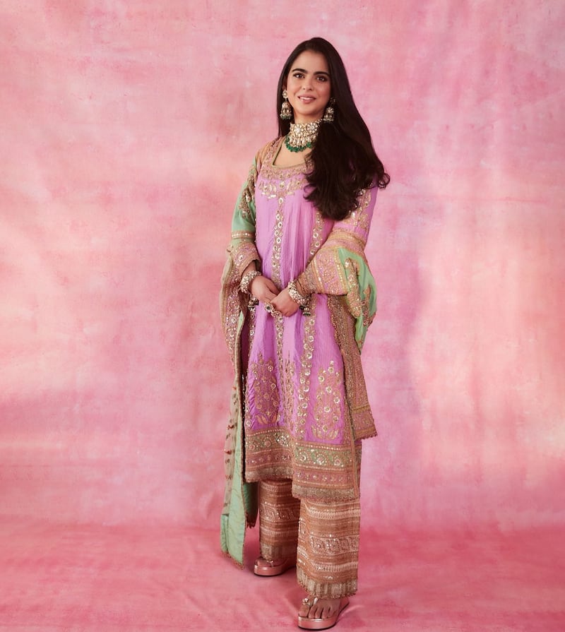 Isha Ambani wore a pink outfit by designer Anuradha Vakil for the pre-wedding mehendi ceremony. Photo: Instagram / stylebyami