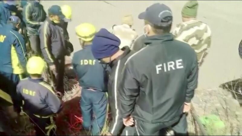 A rescue team works at the site of a flood in Chamoli, Uttarakhand, India, in this still image obtained from a video. Reuters