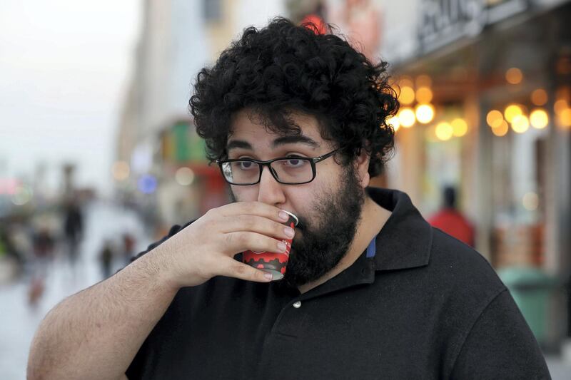 Sharjah, United Arab Emirates - November 27th, 2019: Karak mufti: Abdulla Moaswes. National Day feature on Rounding where people drink tea in their cars. Wednesday, November 27th, 2019, Sharjah. Chris Whiteoak / The National