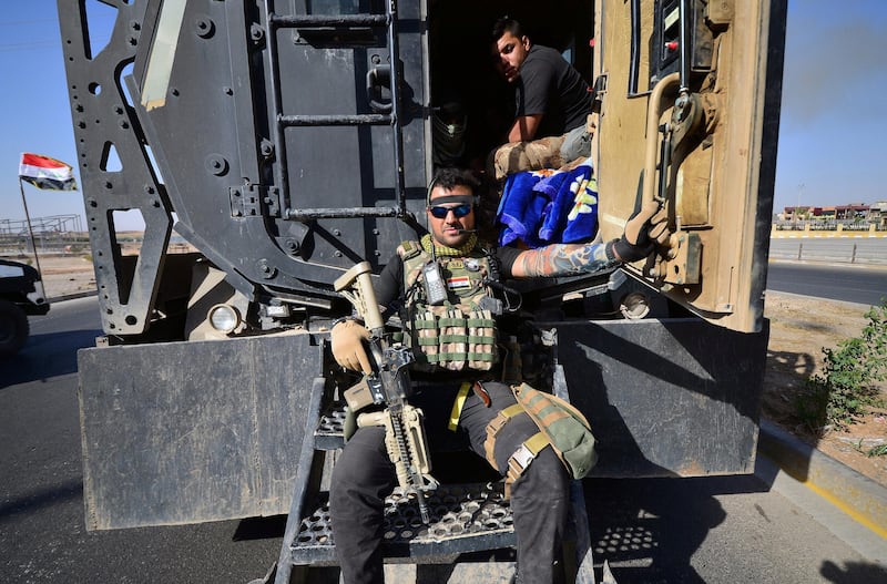 Iraqi security forces members are seen inside a military vehicle as they advance in Kirkuk, Iraq October 16, 2017. REUTERS/Stringer NO RESALES. NO ARCHIVES