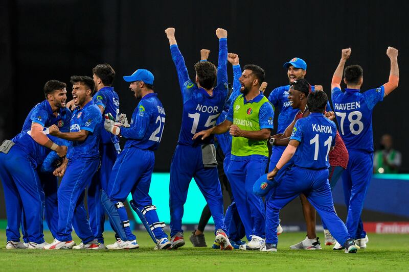 Afghanistan players celebrate beating Bangladesh at Arnos Vale Stadium in Arnos Vale, Saint Vincent and the Grenadines to reach the T20 World Cup semi-finals. AFP
