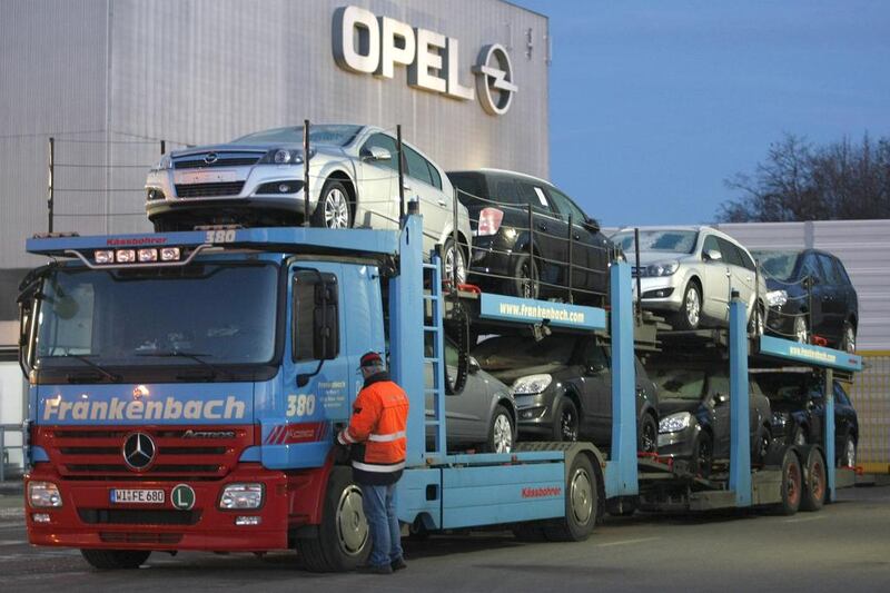 A worker enters a truck loaded with Opel cars at the Opel assembly plant in Bochum. Ina Fassbender / Reuters