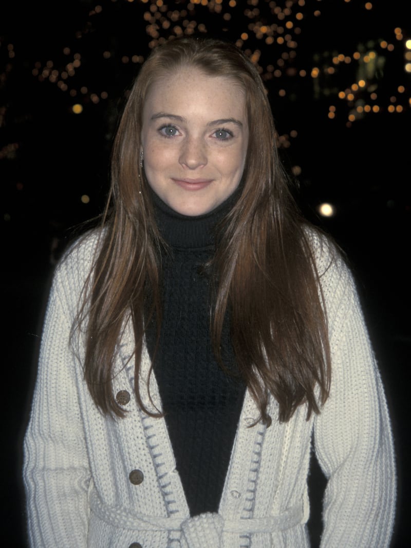 Lindsay Lohan, in a black polo neck and cream knitted cardigan, attends the 'What Women Want' premiere in New York City on December 11, 2000. Getty Images