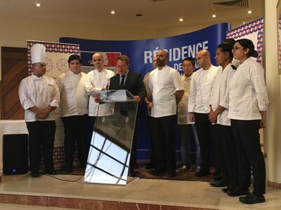 The French Ambassador to the UAE Ludovic Pouille speaks with some of the chefs participating in Taste of France. Evelyn Lau for The National