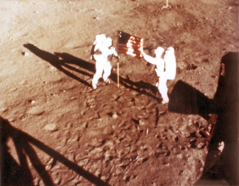 (FILES) In this NASA handout file photo taken on July 20, 1969 US astronauts Neil Armstrong and "Buzz" Aldrin deploy the US flag on the lunar surface during the Apollo 11 lunar landing mission. - Neil Armstrong's sons and the director of a new biopic on the space hero are hitting back against criticism that the film is unpatriotic because of the lack of a flag-planting scene. In a statement issued on August 31, 2018, Rick and Mark Armstrong said "First Man," starring Ryan Gosling, was intended to depict their father's journey to the moon and delve into "the man behind the myth." (Photo by Handout / NASA / AFP) / RESTRICTED TO EDITORIAL USE - MANDATORY CREDIT "AFP PHOTO / NASA " - NO MARKETING NO ADVERTISING CAMPAIGNS - DISTRIBUTED AS A SERVICE TO CLIENTS