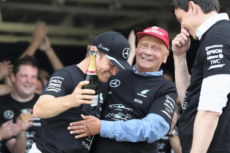 SUZUKA, JAPAN - OCTOBER 09: Nico Rosberg of Germany and Mercedes GP Mercedes GP non-executive chairman Niki Lauda and Mercedes GP Executive Director Toto Wolff celebrate after winning the race and the constructors championship for 2016 during the Formula One Grand Prix of Japan at Suzuka Circuit on October 9, 2016 in Suzuka.  (Photo by Clive Rose/Getty Images)