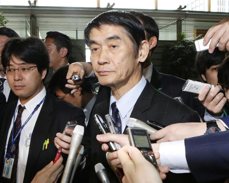 Japan’s disaster reconstruction minister Masahiro Imamura surrounded by journalists after submitting his resignation to prime minister Shinzo Abe in Tokyo on April 26, 2017 due to his remark that ‘it was good’ the March 2011 quake and tsunami had hit northern Japan instead of areas closer to Tokyo. Toshiyuki Matsumoto / Kyodo News via AP