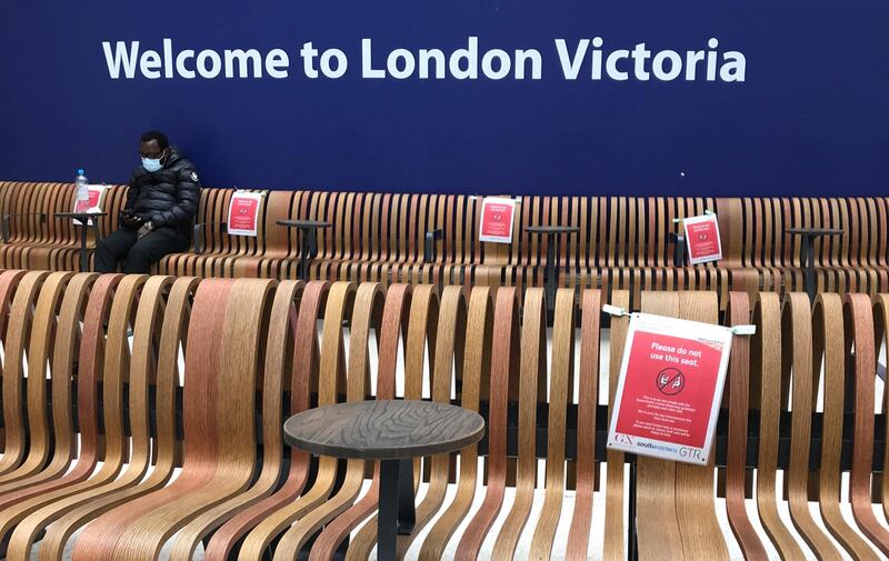 Seats display social-distancing signs at London's Victoria Station, one of the capital's busiest transport centres. AP