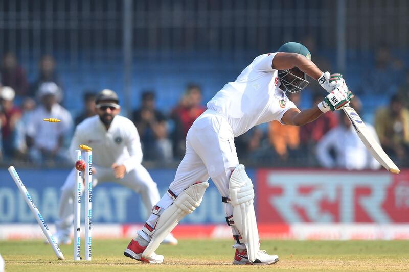 Bangladesh batsman Imrul Kayes is bowled out by India's Umesh Yadav. AFP