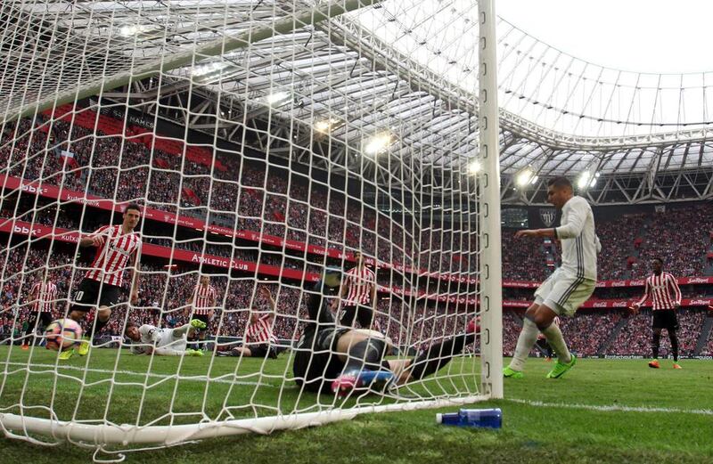 Real Madrid’s Casemiro, right, scores the winning goal. Luis Tejido / EPA