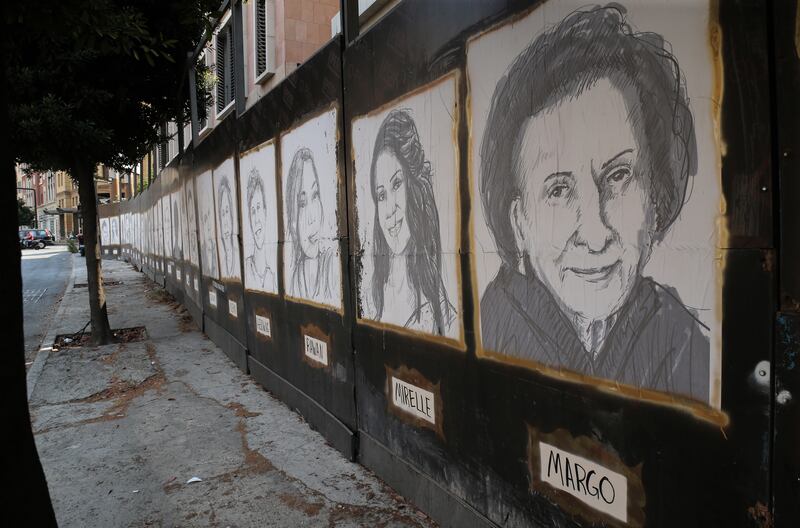 Sketches of victims of the Beirut port explosion adorn a wall near the centre of Lebanon's capital city. EPA