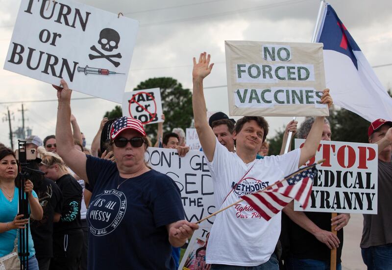 Demonstrators at a hospital in Baytown, Texas, protest against a policy that says hospital employees must get vaccinated against Covid-19 or lose their jobs. A US judge decided that, if the workers did not like the rule, they could find other jobs. AP
