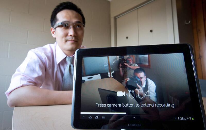 Software developer Brian Ho records video with a Google Glass as a tablet shows the live feed at Vandrico, a Canadian company specialising in wearable computing. AP Photo / The Canadian Press, Darryl Dyck