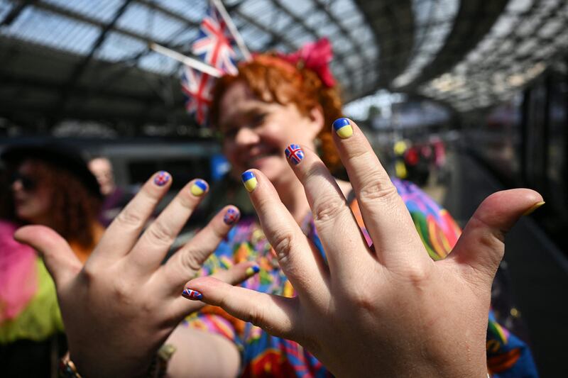 Eurovision fan shows support for UK and Ukraine in Liverpool, which is hosting the contest. AFP
