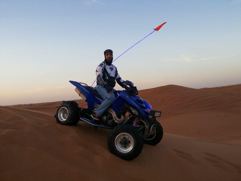 Adel Ali Hussain on his quadbike during a recent desert tour near Dubai. Courtesy: Mr Hussain