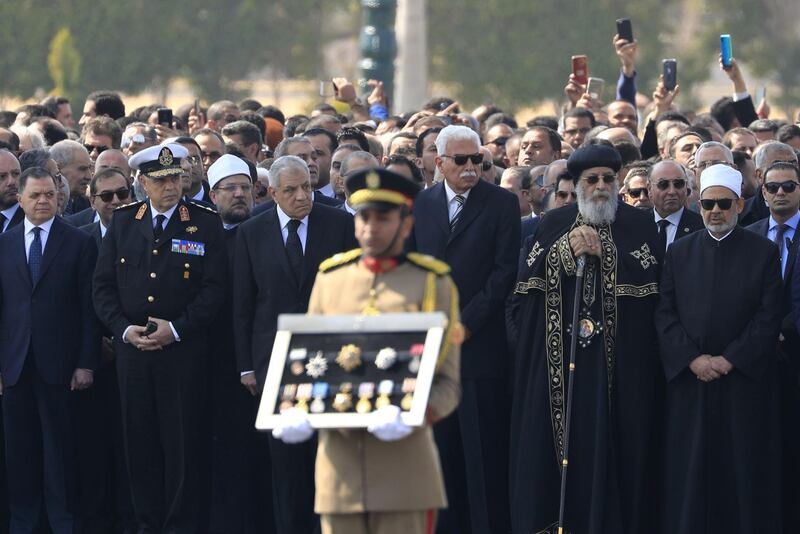 Grand Imam of Al Azhar Ahmed Al Tayeb, right, and Egypt's Pope Tawadros II, second right, the Coptic Orthodox Patriarch of Alexandria  and Palestinian Foreign Minister Riyad Al-Maliki, third right, stand among other Arab officials during the funeral ceremony of Egypt's former president Hosni Mubarak at Cairo's Mosheer Tantawy mosque. AFP