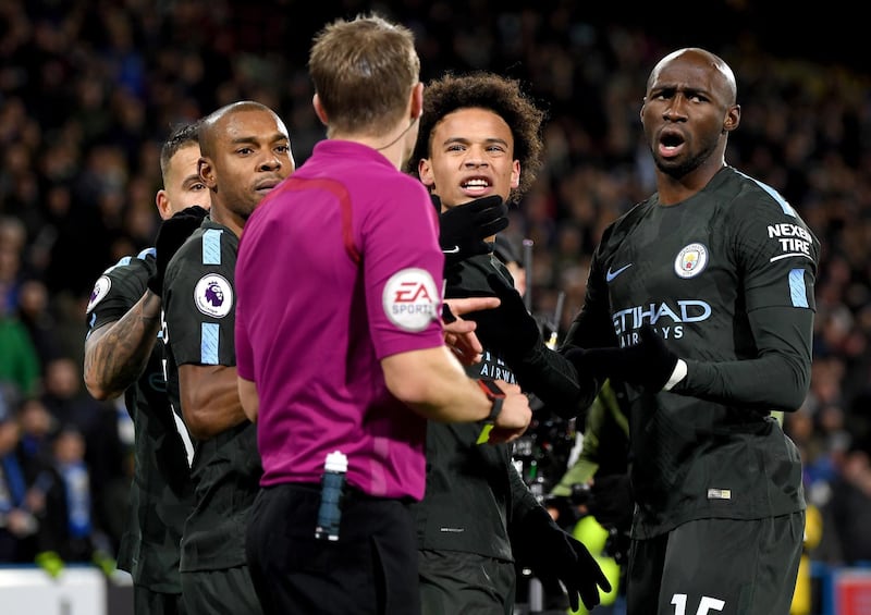 HUDDERSFIELD, ENGLAND - NOVEMBER 26:  Fernandinho, Leroy Sane and Eliaquim Mangala of Manchester City argue with the referee, Craig Pawson after the Premier League match between Huddersfield Town and Manchester City at John Smith's Stadium on November 26, 2017 in Huddersfield, England.  (Photo by Shaun Botterill/Getty Images)