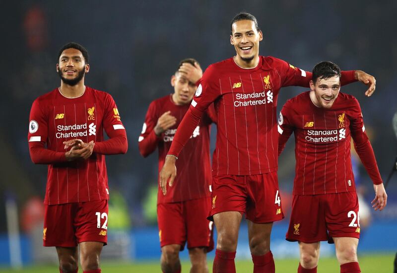 Liverpool's Virgil van Dijk and Andrew Robertson, right, after the win at The King Power Stadium. PA