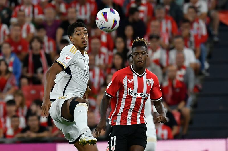 Jude Bellingham and Athletic Bilbao's Nico Williams challenge for the ball. AP