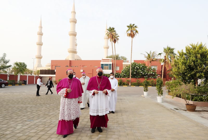 The outgoing and incoming Apostolic Vicar for Southern Arabia walk together to St Joseph's.