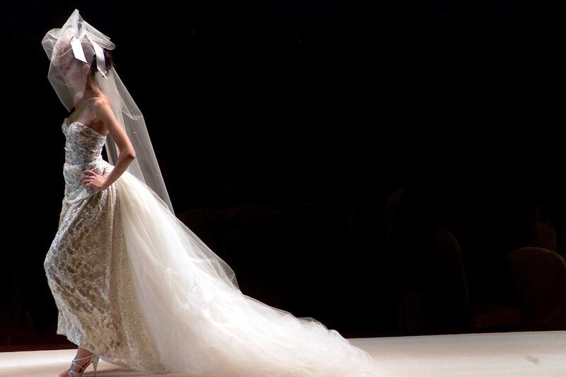 A model in a gown by designer Emanuel Ungaro in his spring-summer 2004 collection during Dubai fashion week at the Dubai Shopping Festival, February 5, 2004. AFP