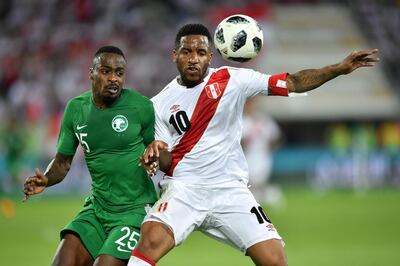 Saudi Arabia's defender Motaz Hawsawi (L) vies with Peru's forward Jefferson Farfan during an international friendly football match between Saudi Arabia and Peru at Kybunpark stadium in St. Gallen on June 3, 2018.  - 
 / AFP / Fabrice COFFRINI
