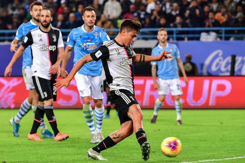 Juventus' Argentine forward Paulo Dybala shoots to score during the Supercoppa Italiana final football match between Juventus and Lazio at the King Saud University Stadium in the Saudi capital Riyadh on December 22, 2019. / AFP / GIUSEPPE CACACE
