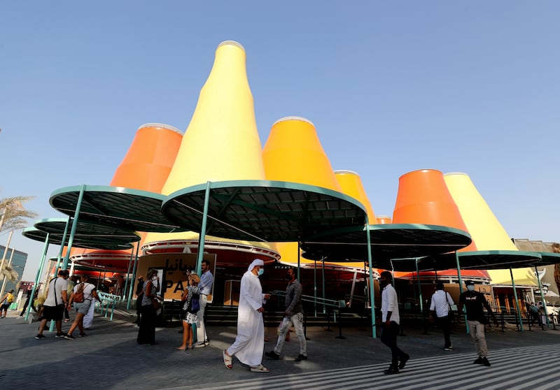 People pass by the Spain pavilion during the first day of Expo 2020 Dubai. AP