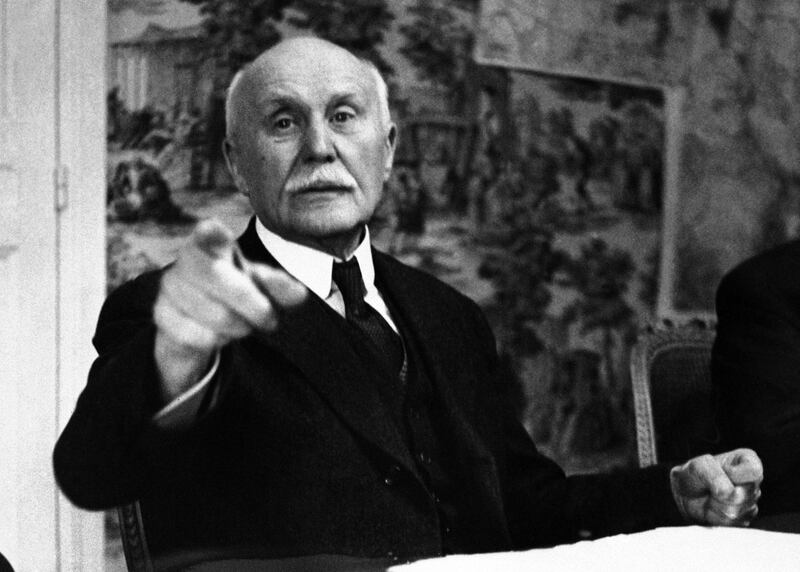 FILE - This June 9, 1941file photo shows France's Marshal Philippe Petain pointing as he ordered our photographer from the room during the sell-out meeting of the Council of Ministers in Vichy, central France. French President Emmanuel Macron waded onto controversial ground Wednesday Nov.7, 2018 by praising a World War I general who subsequently collaborated with the Nazis in World War II.(AP Photo, File)