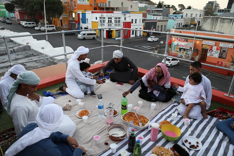 A Muslim family breaks their fast with the Iftar meal during the holy month of Ramadan in the historic Bo-Kaap district in Cape Town, South Africa, May 22, 2020. REUTERS/Sumaya Hisham