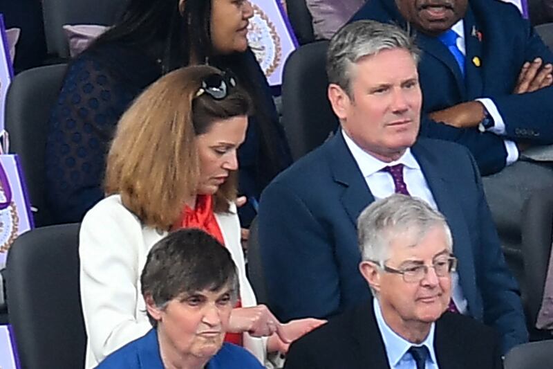 Labour Party leader Sir Keir Starmer and his wife Victoria get ready to watch the acts. AFP