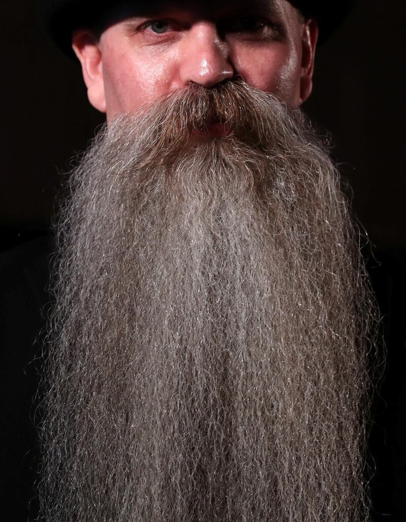 A participant of the international World Beard and Moustache Championships poses before taking part in one of the 17 categories of beard and moustache styles competing in Antwerp, Belgium. Reuters