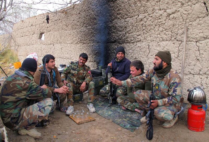 Members of the Afghan security forces rest during an operation against Taliban fighters in Nad Ali district of Helmand province, Afghanistan in December 2015. The Taliban seized control of the Sangin district in southern Helmand province in late December. Watan Yar/EPA