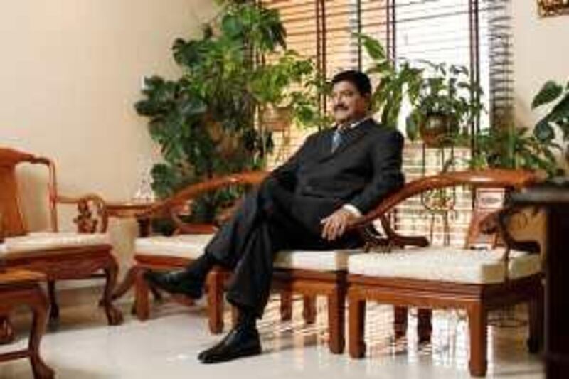 ABU DHABI, UNITED ARAB EMIRATES - December 31, 2009: Dr B. R. Shetty, Managing Director and CEO of NMC Group (NMC Specialty Hospital, UAE Exchange, Neopharma) sits for a portrait in his office. 
( Ryan Carter / The National ) *** Local Caption ***  RC004-DrShetty20091231.jpg