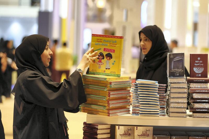 ABU DHABI,  UNITED ARAB EMIRATES , April 24 – 2019 :- Visitors browsing books at the Abu Dhabi International Book Fair held at Abu Dhabi National Exhibition Centre in Abu Dhabi. ( Pawan Singh / The National ) For News/Online/Instagram. Story by Rupert