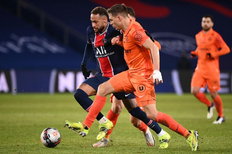 Paris Saint-Germain's Brazilian forward Neymar vies for the ball with Montpellier's French defender Arnaud Souquet. AFP