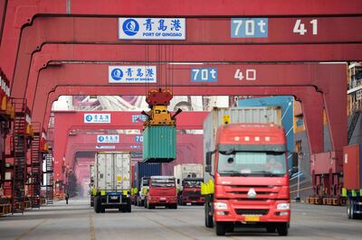 epa06644666 (FILE) - Trucks transport containers at a port in Qingdao, Shandong province, China, 08 March 2018 (issued 04 April 2018). China will place 25 percent tariffs on a list of 106 US goods, in a retaliatory action against the US's new tariff on Chinese products.  EPA/YU FANGPING CHINA OUT