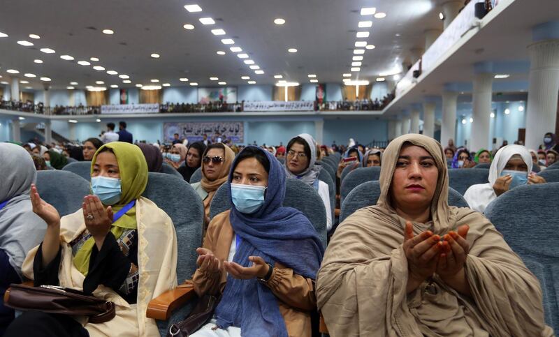 Afghan women pray as they attend the ending ceremony of the loya jirga.  EPA