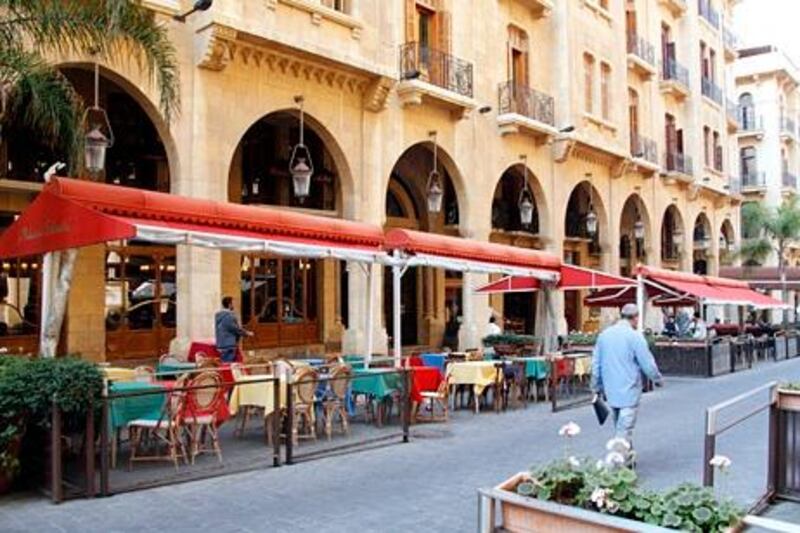 People walk past empty restaurants in downtown Beirut November 20, 2012. In addition to tumbling exports, Lebanon's tourist industry has declined by as much as 15 percent. Most Gulf countries warned their citizens this year not to visit Lebanon after clashes erupted between supporters and opponents of the Syrian uprising. Lebanon has also lost most of the 600,000 Arab tourists who usually drive into Lebanon through Syria each year. To match Reuters Summit MIDEAST-SUMMIT/LEBANON-SYRIA  REUTERS/Mohamed Azakir  (LEBANON - Tags: BUSINESS FOOD TRAVEL)