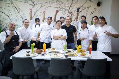 Feby Baguisa with her staff at Feby’s Restaurant and Cafe at BoonMax Hotel, Deira. Ruel Pableo for The National
