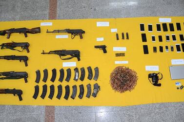 Security forces seized seven machine guns, three grenades and a number of firearms from the house. SPA