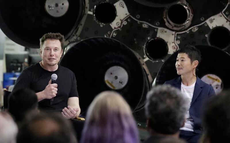 SpaceX founder Elon Musk (L), introduces Japanese billionaire Yusaku Maezawa as the first private passenger on a trip around the moon, in September 2018. AP