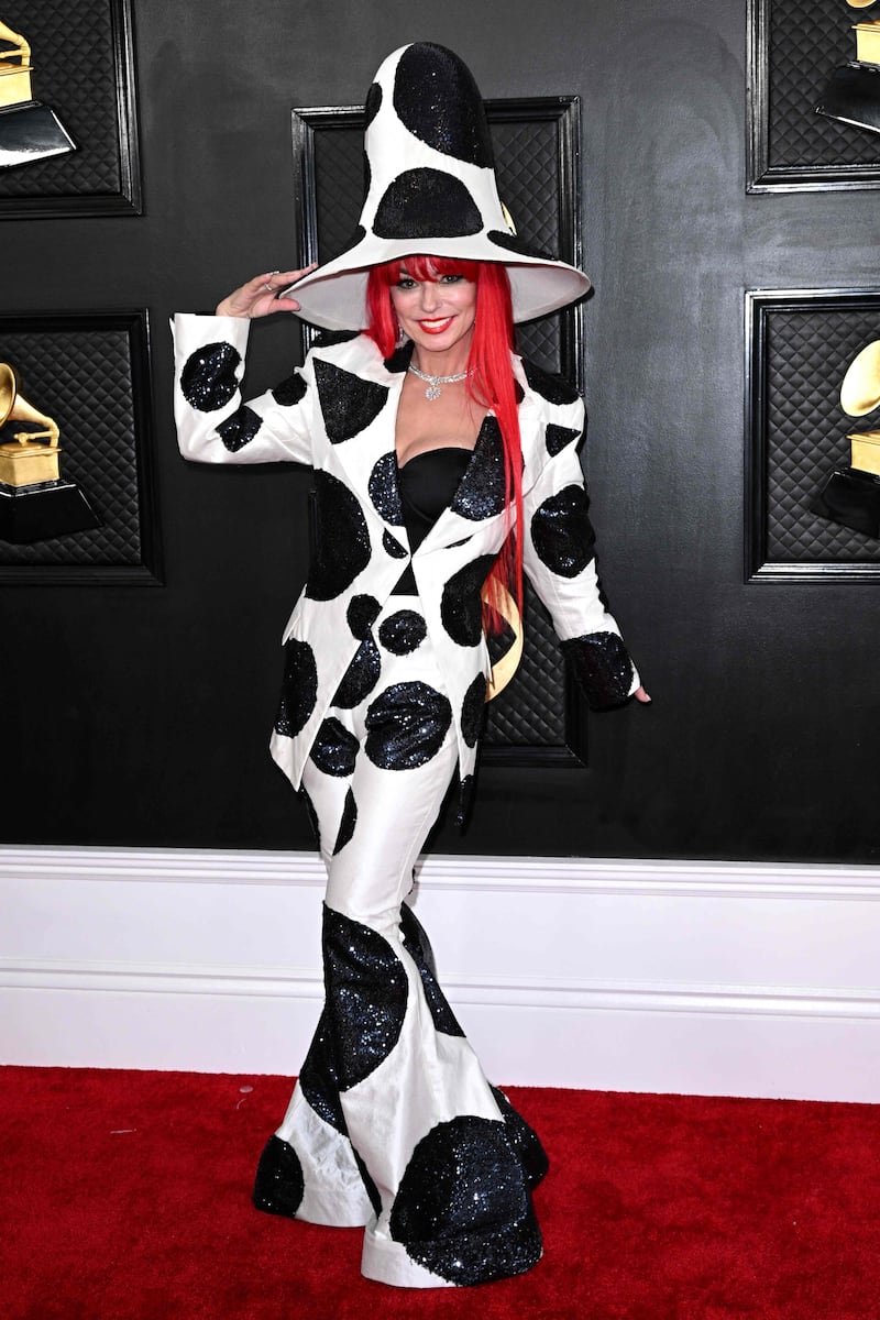 Shania Twain wears a polka dot suit and matching hat by Harris Reed. AFP