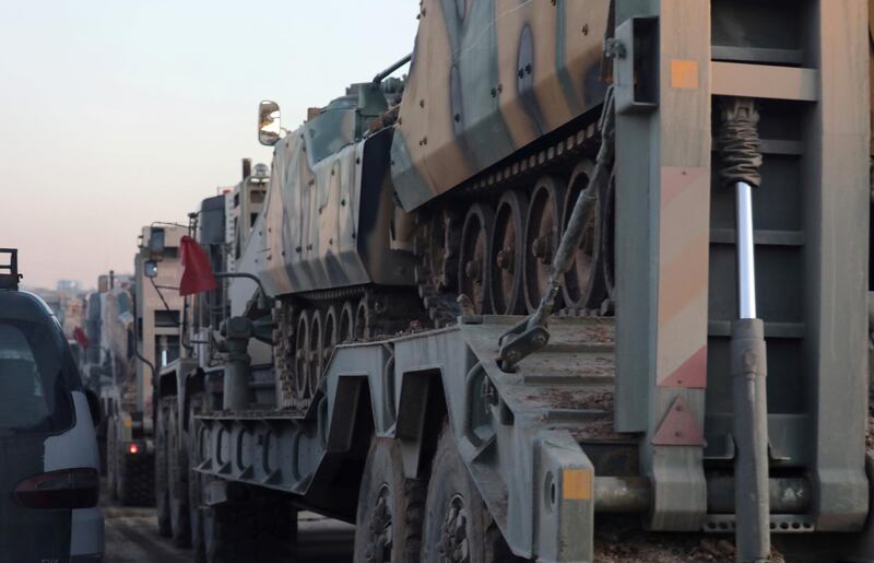 Turkish military vehicles enter the Bal al-Halwa crossing at the Syrian-Turkish border, in Idlib governorate, Syria. REUTERS