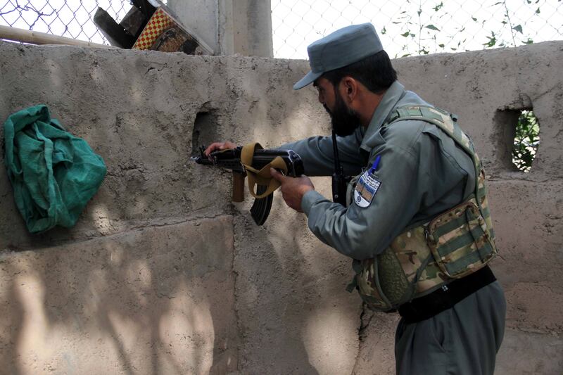 An Afghan security official guards the UN office in Herat, Afghanistan, on July 31, 2021. The office had been attacked by 'anti-government elements' the previous day.