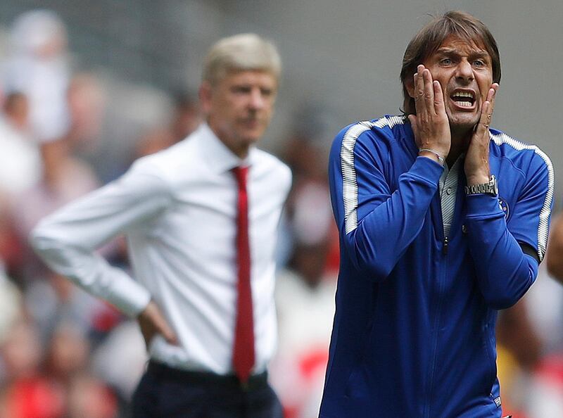 FILE - This is a Sunday, Aug. 6, 2017  file photo of Chelsea's team manager Antonio Conte, right, and Arsenal manager Arsene Wenger as they react during the English Community Shield soccer match between Arsenal and Chelsea at Wembley Stadium in London.  Antonio Conte ignited the first managerial feud of the season when he said that Chelsea must avoid â€œa Mourinho seasonâ€ as the champions seek to defend their Premier League title. (AP Photo/Frank Augstein/File)