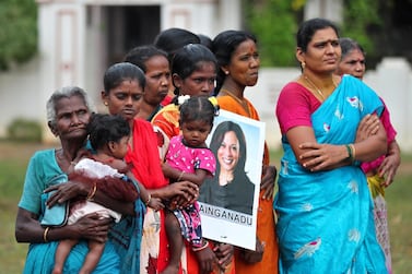 Indian women, one holding a placard featuring US Vice President-elect Kamala Harris during celebrations for her victory, in Painganadu a neighboring village of Thulasendrapuram, the hometown of Harris's maternal grandfather, India, Sunday, November 8, 2020. AP Photo