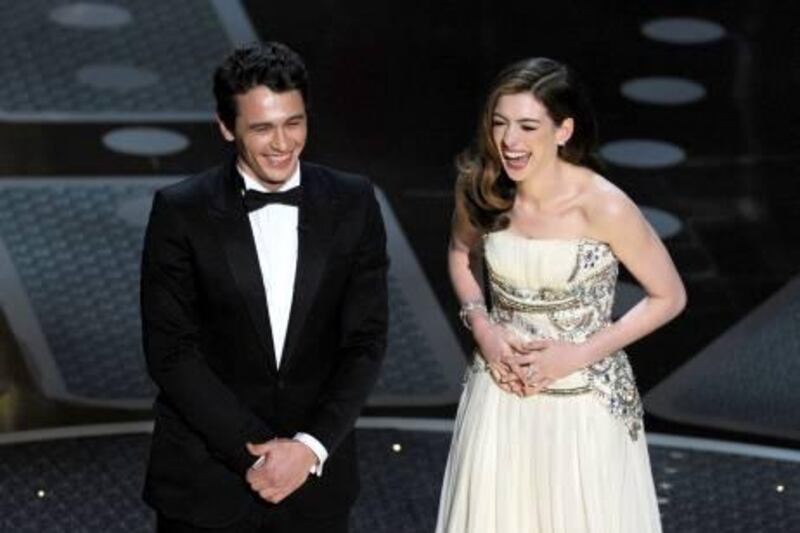 Actor James Franco and Anne Hathaway appear on stage  at the 83rd Annual Academy Awards held at the Kodak Theatre on February 27, 2011 in Hollywood, California. AFP PHOTO / GABRIEL BOUYS

 *** Local Caption ***  403205-01-08.jpg
