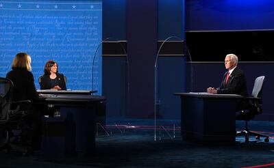 US Vice President Mike Pence Mike Pence (R) and US Democratic vice presidential nominee and Senator from California, Kamala Harris participate in the vice presidential debate in Kingsbury Hall at the University of Utah on October 7, 2020, in Salt Lake City, Utah.  / AFP / Robyn Beck
